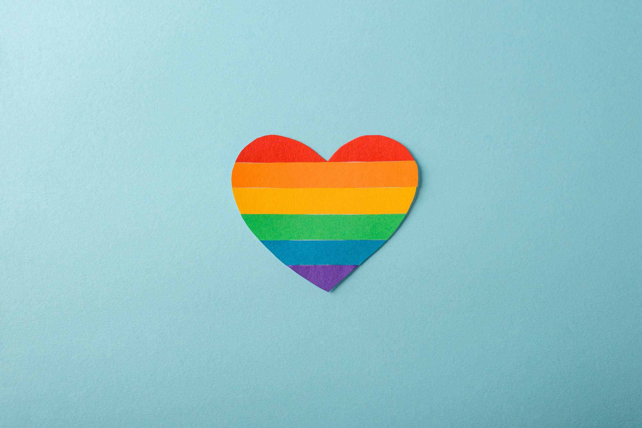 Rainbow heart on blue. LGBT flag, gay pride concept